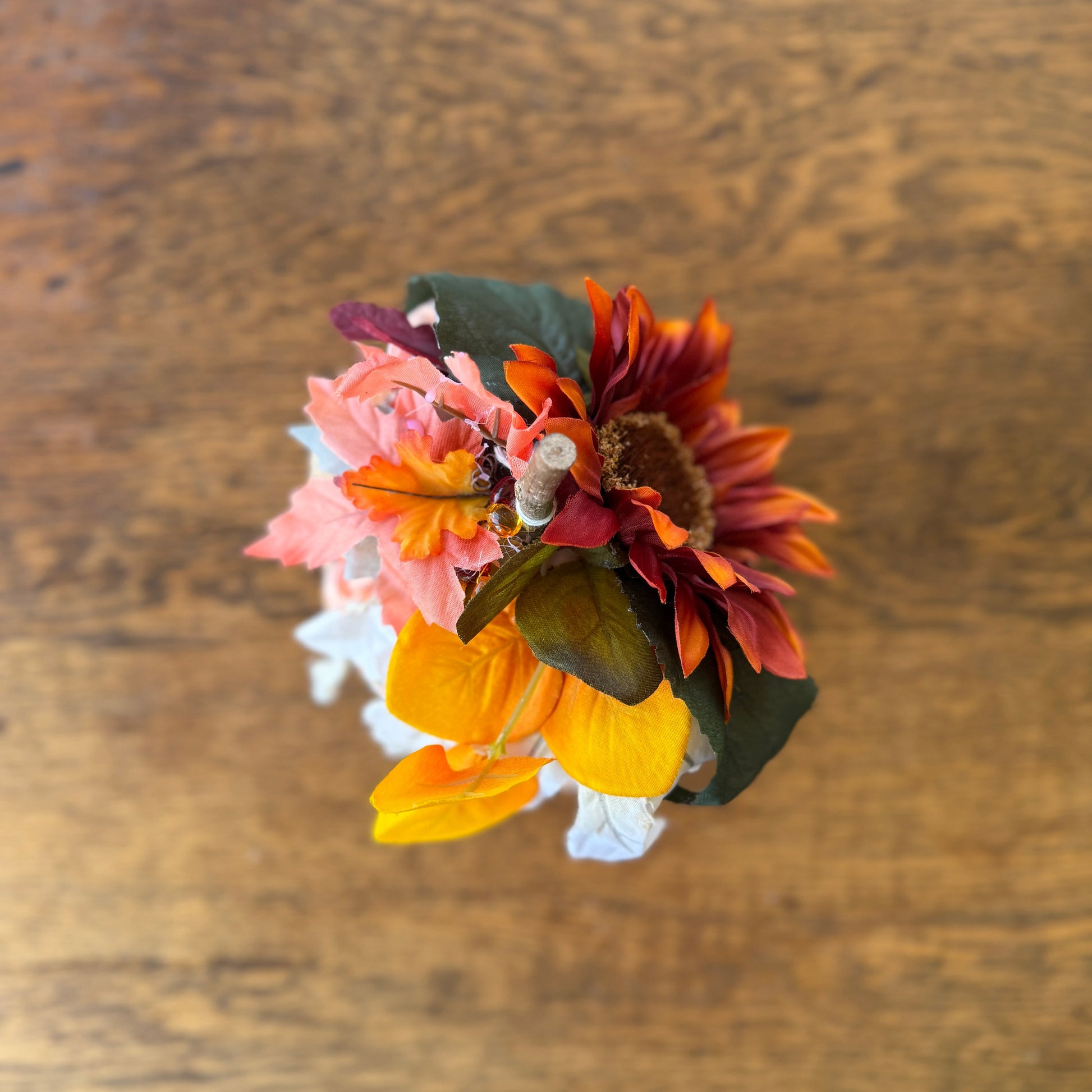 Small bouquet of flowers on a wooden surface