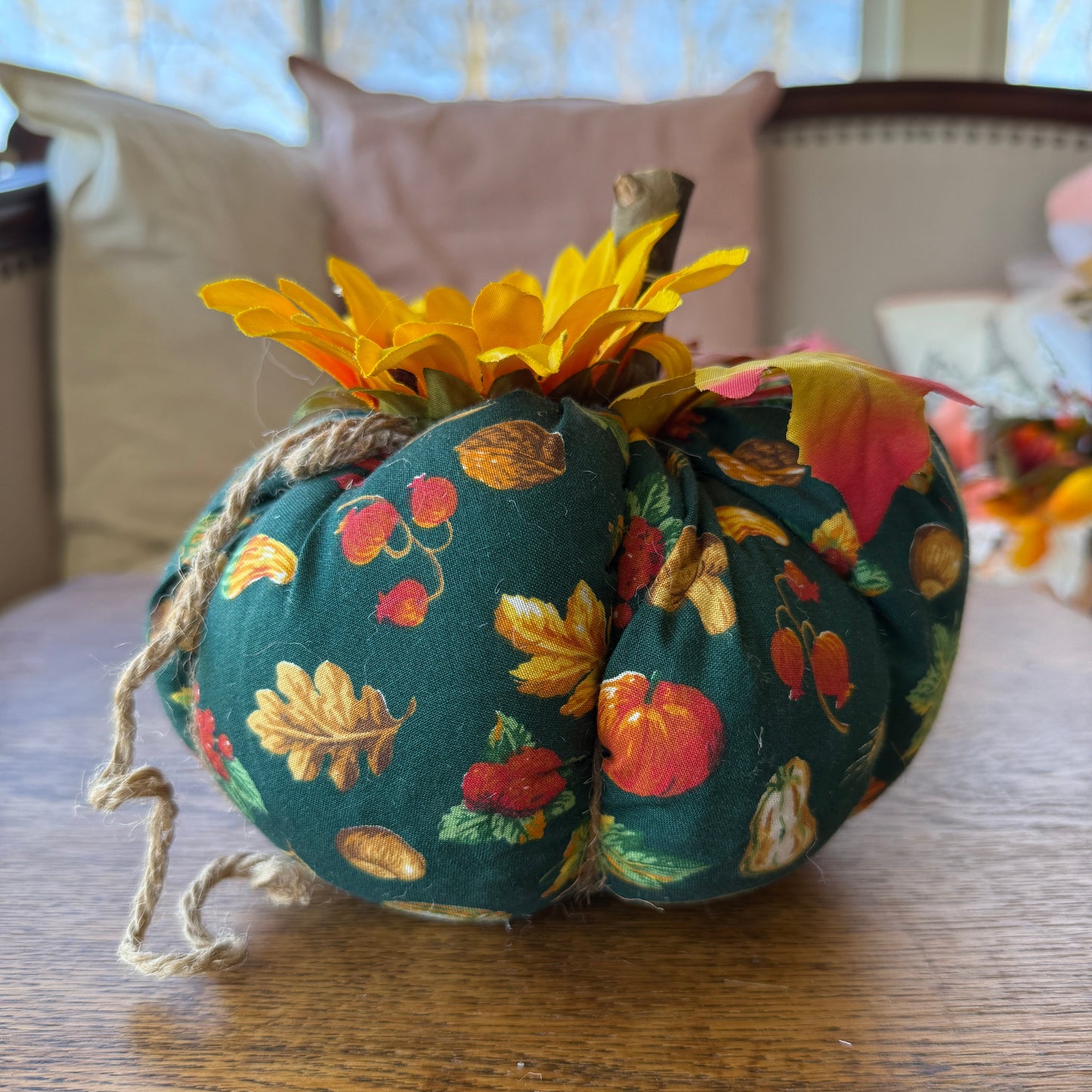 Decorative headscarf with autumnal pattern on a wooden surface