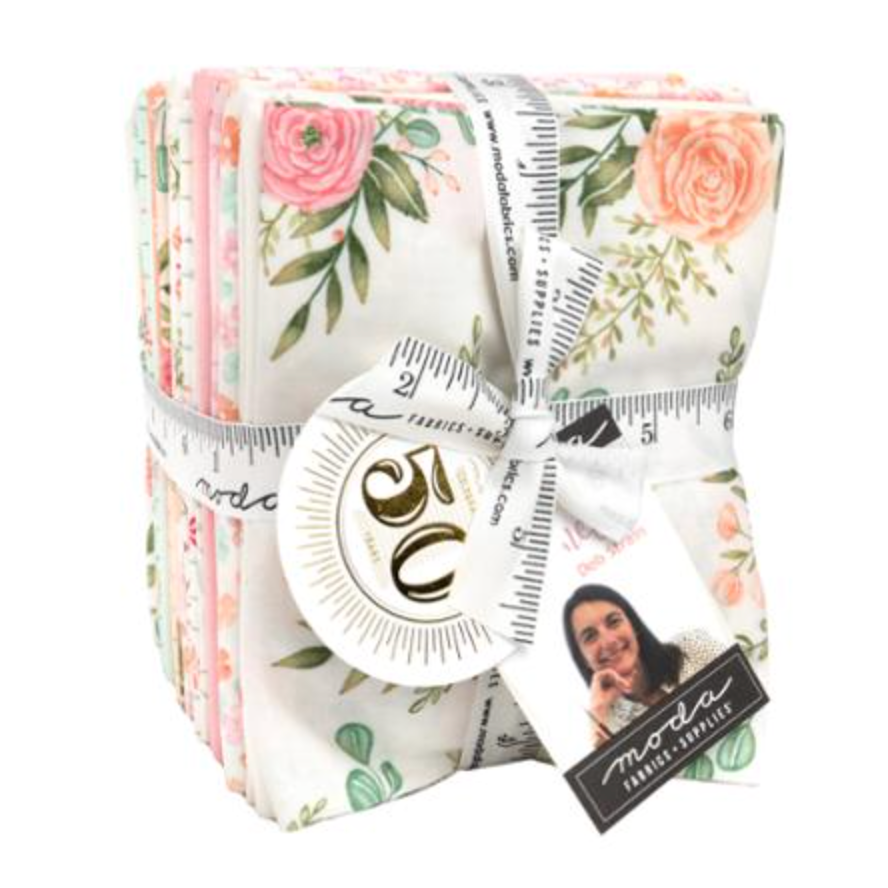 Pack of fabric squares with floral design and ruler, featuring Moda brand.